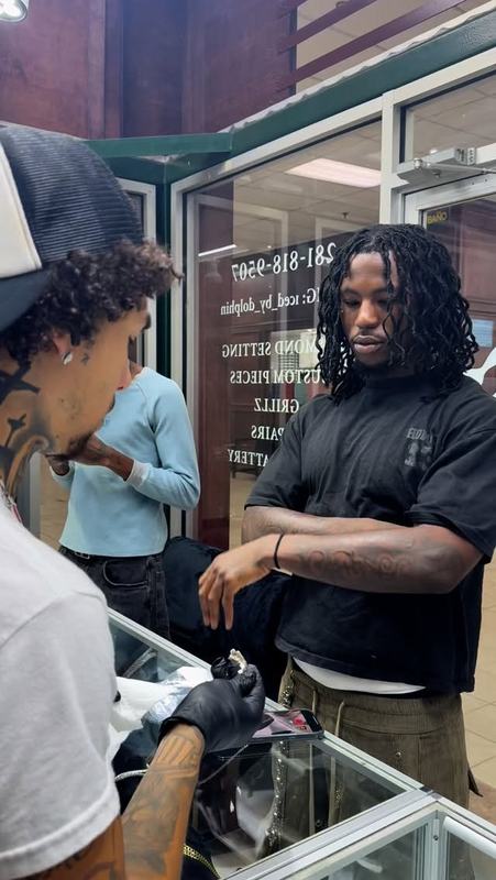 Rokk at the showcase with a client